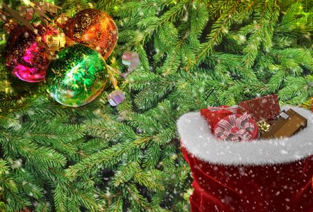 Christmas greeting: on the background of Christmas tree ornaments and gifts. 3D rendering.の写真素材