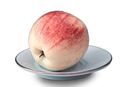 Ripe Apple on the table on a plate.の写真素材