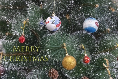 Christmas and New Year greeting card with a picture of a decorated Christmas tree and a greeting inscription.の写真素材