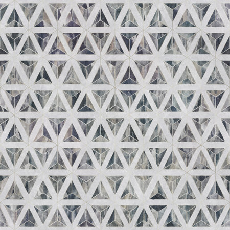 A fragment of the walls of the house are covered with ceramic tiles that mimic natural stone.