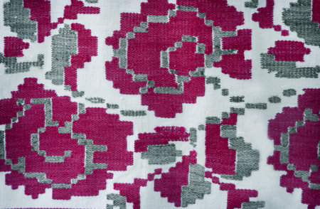 A fragment of ancient fabric with a beautiful pattern, made on a handmade loom.