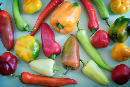 Ripe fruits of different varieties of bell pepperの写真素材