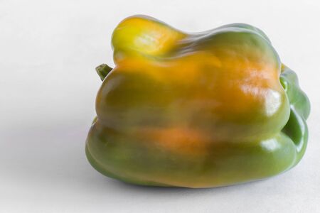 Close-up-the fruit of yellow bell pepper. Presented on a light background.の写真素材