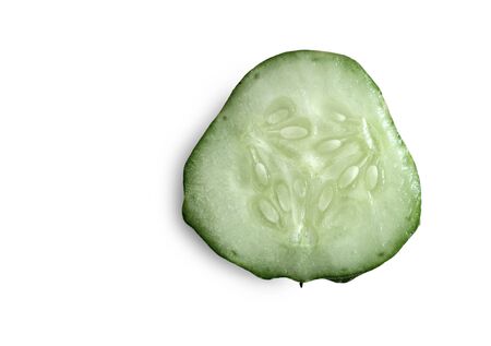 Cross-section of cucumber, top view, close-up, isolated on white background. Healthy food concept, natural product.の写真素材
