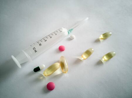 Different forms of drugs: tablets, ampoules, capsules, blister pack on a light background. Medicine and pharmacy.の写真素材