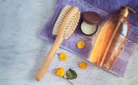 Shower gel, massage brush and skin cream.