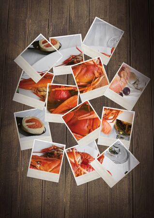 Scattered collage on the background of old wooden planks with images of boiled crawfish and beer. Concept of gourmet food.の写真素材