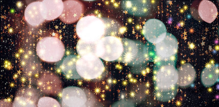 Abstract holiday background with bokeh and lights on a dark backgroundの写真素材