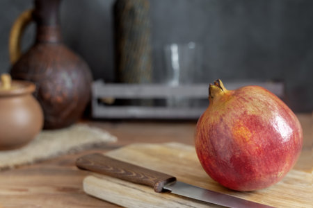 Ripe juicy fruit pomegranate on the table