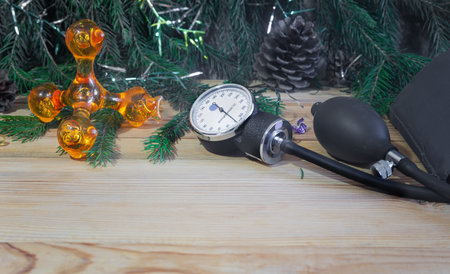 Christmas in medicine: sphygmomanometer , massager and Christmas decorations, garlands.