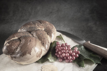 A loaf of white bread and viburnum berries