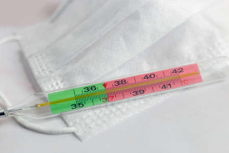 The thermometer shows an elevated temperatureの写真素材