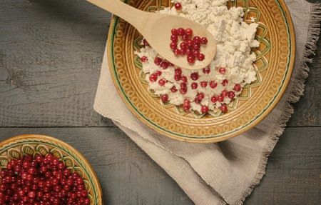 Delicious cottage cheese with red currant berriesの写真素材