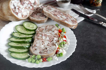 Meat appetizer: pork stomach stuffed with meat and lard.の写真素材