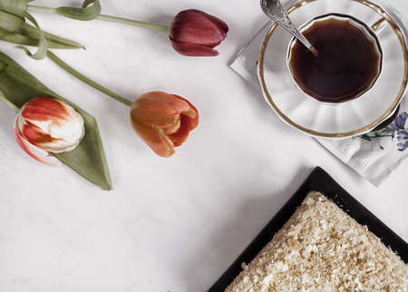 A decaf hot chicory drink and a cake.の写真素材