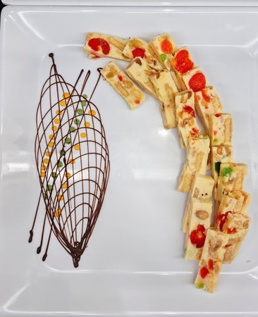 Delicious cakes on a plate on the tableの写真素材