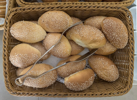Delicious buns in a wicker basket on the table.の写真素材
