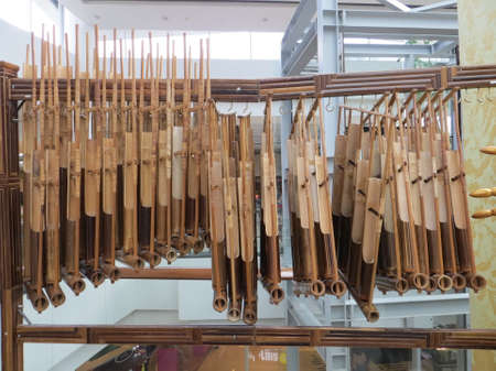 SERPONG, INDONESIA - March 25, 2018: Angklung, Indonesian musical instrument consisting of two to four bamboo tubes suspended in a bamboo frame, bound with rattan cords.のeditorial素材