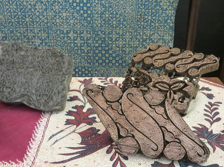 JAKARTA, INDONESIA - June 8, 2017: Batik clothes with canting cap, copper stamp for making batik patterns.のeditorial素材