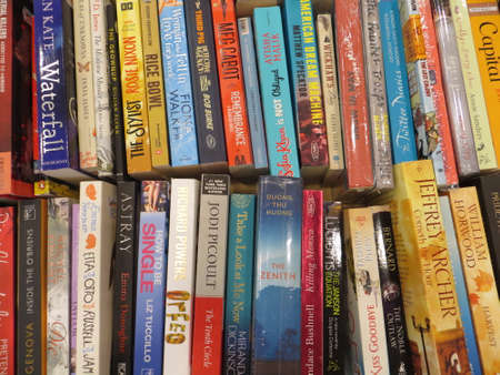 TANGERANG, INDONESIA - April 9, 2018: Rows of fiction books for sale on books fair at ICE BSD City.のeditorial素材