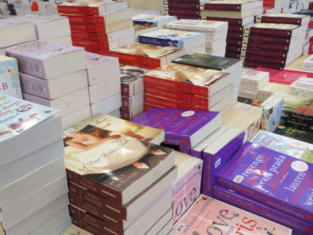 TANGERANG, INDONESIA - April 22, 2017: Stacks of fiction books for sale on books fair at ICE BSD City.のeditorial素材