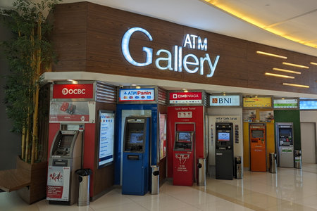 Tangerang Selatan, Indonesia - December 17, 2023 : Rows of ATM machines from various banks in Indonesia.のeditorial素材