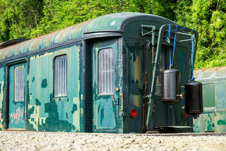 Various rusted wagons and train on the tracks at the lost railway stationのeditorial素材