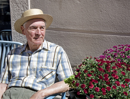 Senior sitting on the benchの写真素材