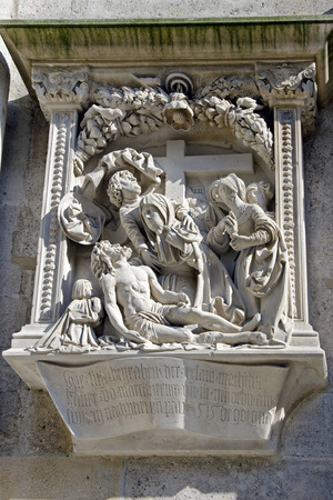 The relief of pieta on the west facade of st. Stephen cathedral.のeditorial素材