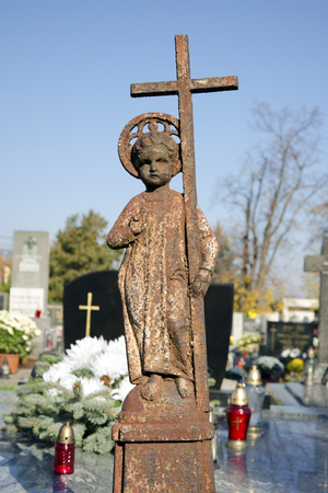 The child Jesus with cross: the old bronze tombstoneの写真素材