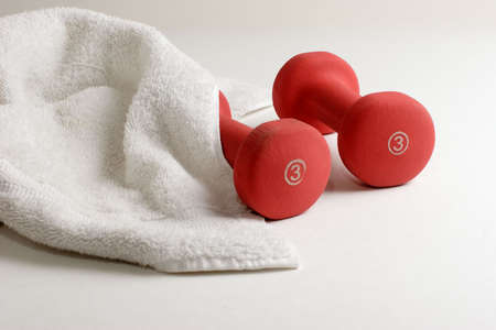 Pair of dumbells and sweat towel - workout gearの写真素材