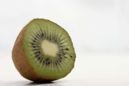 isolated fresh slice of kiwiの写真素材