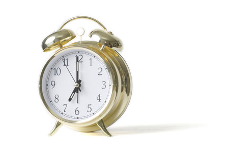 Gold alarm clock isolated on white