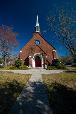 exterior of an old Lutheren church in charleston south carolina with blue sky as backgroundの写真素材