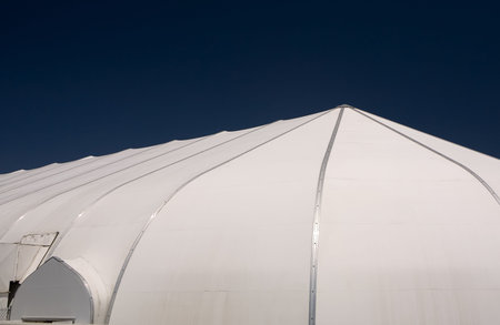 Outside shot of a white dome shape plastic tent used as a worship center at a churchの写真素材