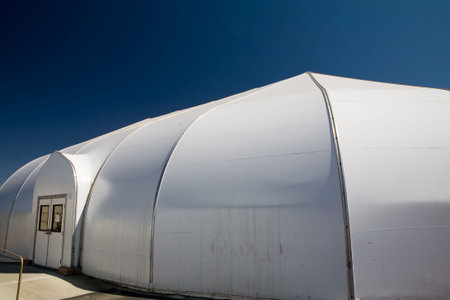 Outside shot of a white dome shape plastic tent used as a worship center at a church
