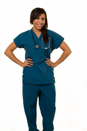 Full body of an attractive young brunette Hispanic woman health care worker standing with a smiling friendly expression on whiteの写真素材