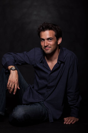 Young attractive brunette twenties caucasian man in fashionable attire