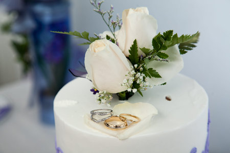 Wedding cake and topper with ringsの写真素材