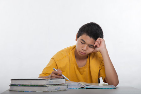 Teenage high school boy studying