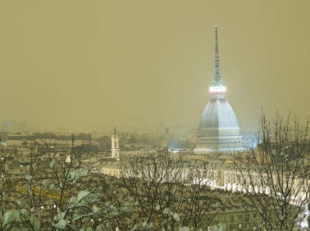 Torino by night with the snowの写真素材