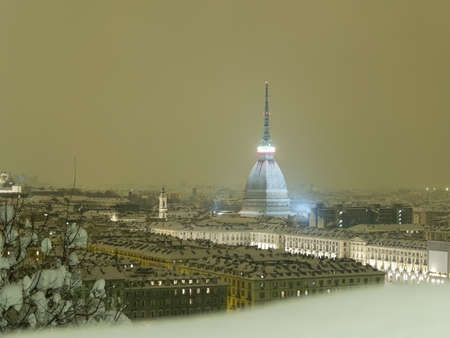 Torino by night with the snowの写真素材