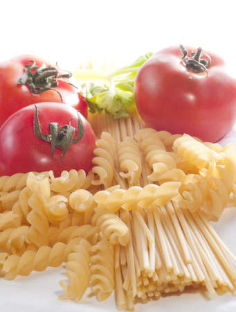 Pasta  tomato and and basil on white backgroundの写真素材