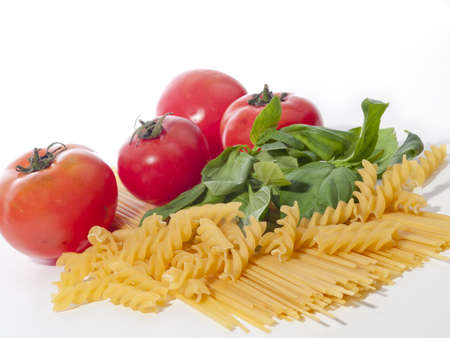 Pasta  tomato and and basil on white backgroundの写真素材