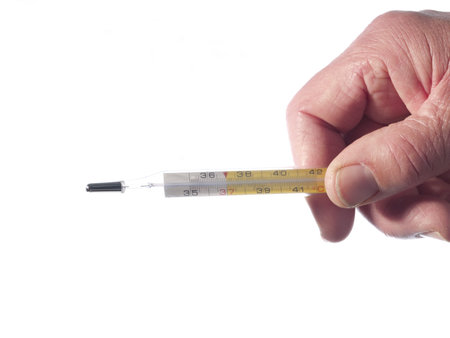 An hand holds a thermometer on white background
