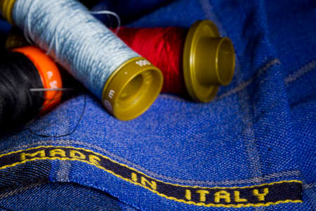 Italian fabric with blurred fuzes and needleの写真素材