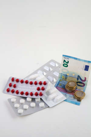 Blister of medicines with moneyの写真素材