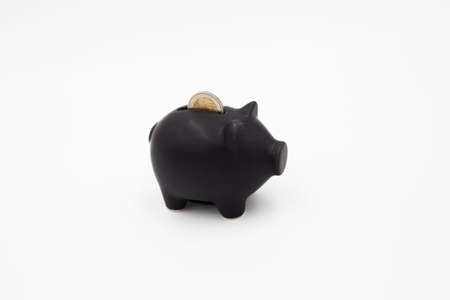 Black piggy bank on a white backgroundの写真素材