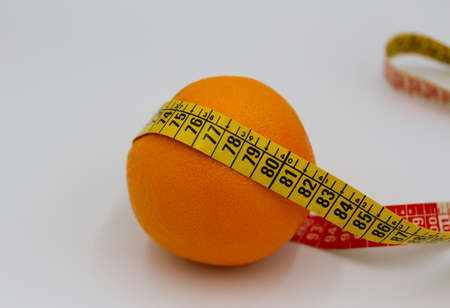orange and centimeter on a white backgroundの写真素材