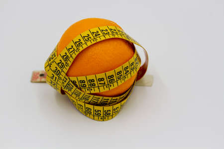 orange and centimeter on a white backgroundの写真素材